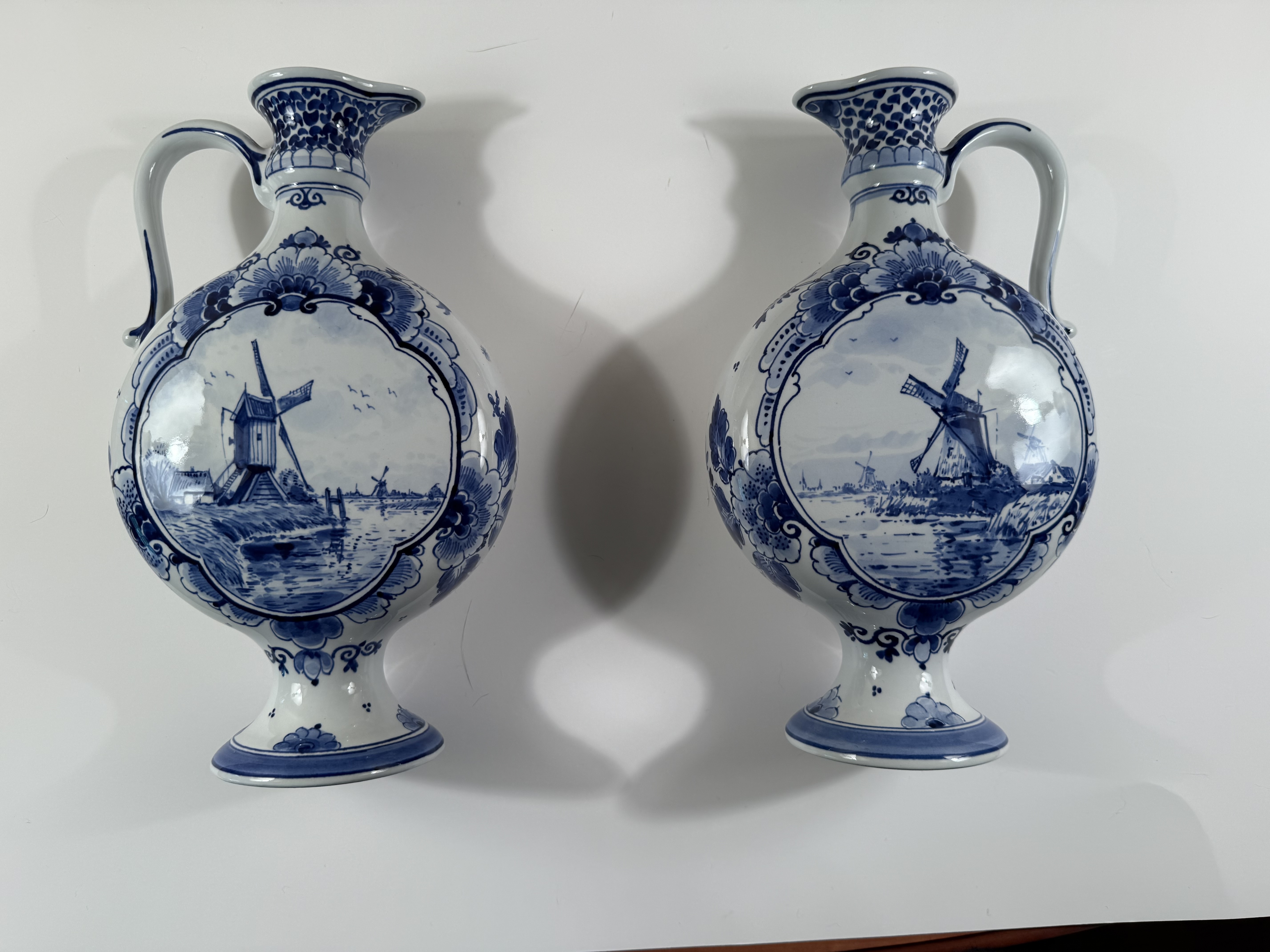 A Matched Pair of Delft Blue and White Handled Ewers/Vases